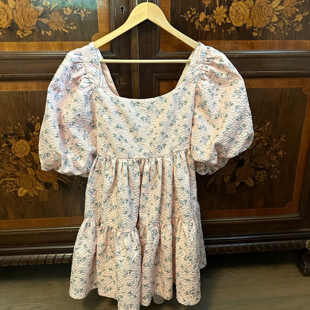 Pink floral babydoll dress with large boy on the back. Worn once great condition